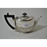 Small London silver bachelor's teapot, with half gadroon decoration and ebonised handle, 7.5 troy