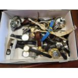 Box containing a quantity of various quartz wristwatches, including a Seiko automatic and a small