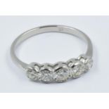 Platinum and five stone diamond ring with rub-over setting, approximately 0.7ct total This is a