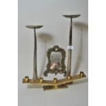 Pair of modern steel candle stands of stylised design, metal photograph frame and a brass five light