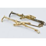 9ct Yellow gold and silver bar brooch in the form of a riding crop with a fox and another 9ct gold