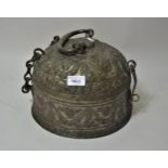 Large Middle Eastern circular floral embossed metal spice box, the hinged cover enclosing various