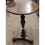 Mahogany circular pedestal table with a baluster turned column and triform base, 20ins diameter,