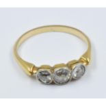 Yellow gold three stone old brilliant cut diamond ring Ring size M Inclusions visible in all