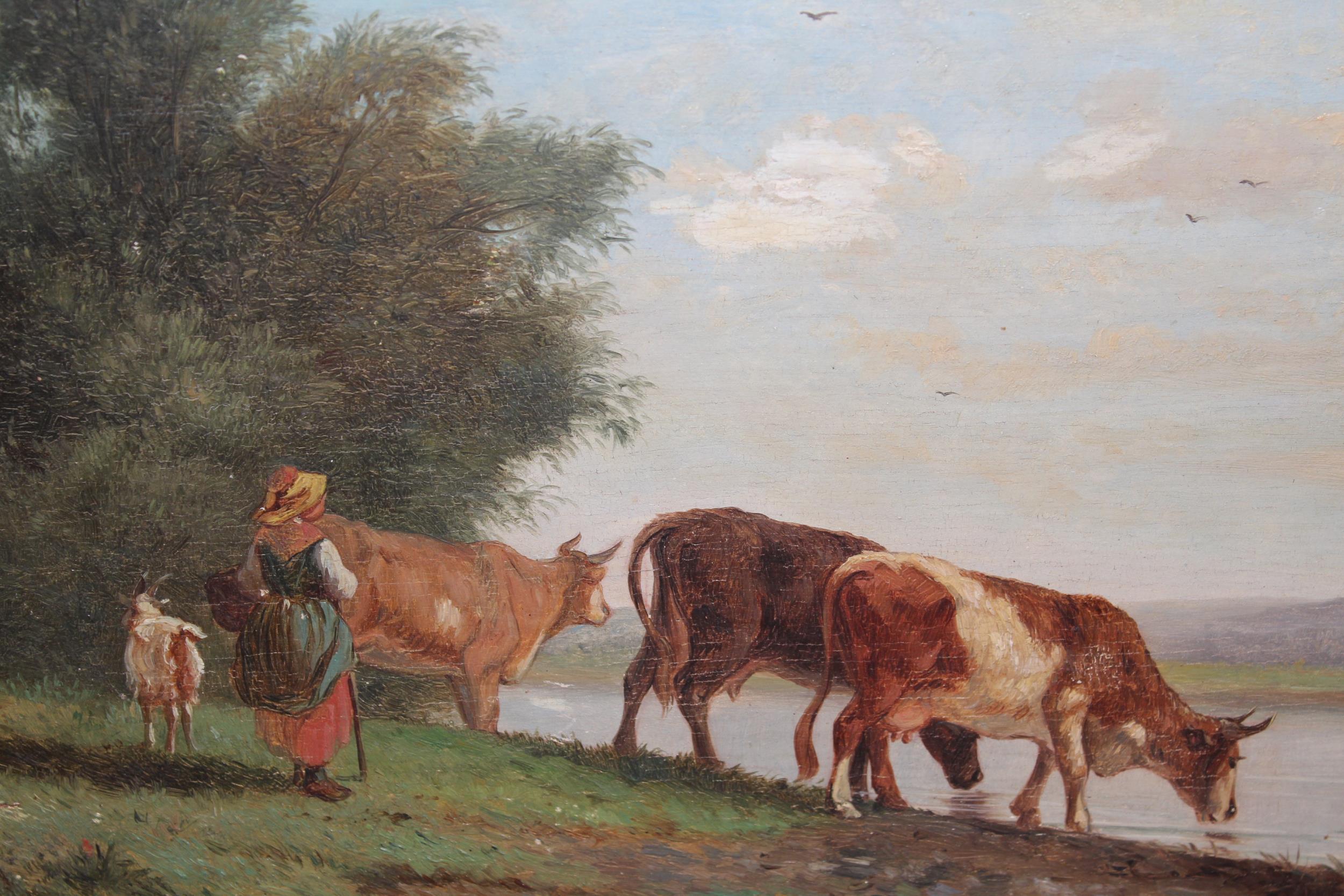 Early 19th Century oil on oak panel, young lady with cattle by a lake, heavy gilt framed, 8ins x