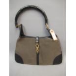 Ladies Gucci black leather and textile handbag, together with dust cover