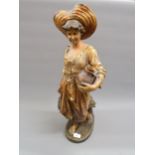Large Goldscheider terracotta figure of a girl water carrier, signed E. Tell to the base, 26ins high