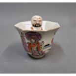 Chinese octagonal cup mounted with a figure to the centre and enamel and painted decoration of