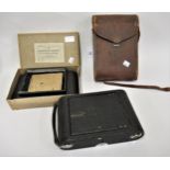 Large Eastman Kodak folding bellows camera in leather case, with accessories