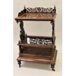 Victorian figured walnut Canterbury whatnot, the galleried top on pierced end supports, the base