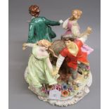 Large Naples porcelain group of four figures dancing around a tree strump various areas of