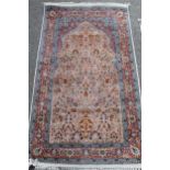 Small cotton prayer rug of Persian design with an all-over vase and floral pattern in shades of pink