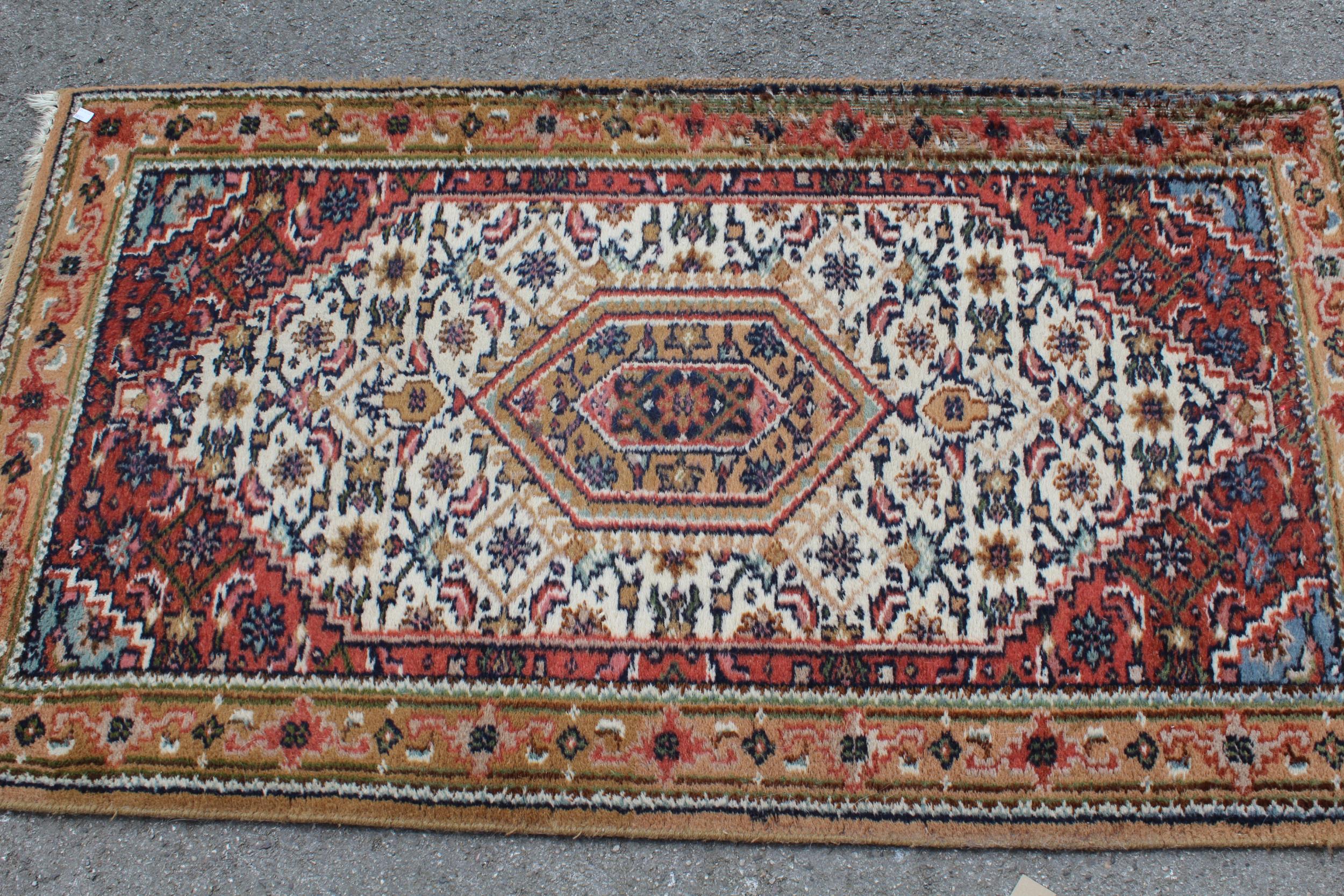 Indo Persian runner of Afghan design with a repeating hooked medallion pattern, on a rose ground - Image 5 of 6
