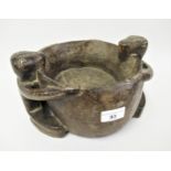 Native carved tribal art bowl, the side handles in the form of two seated figures, 10.5ins x 5.5ins