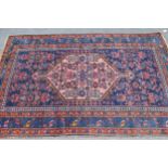 Hamadan rug with a lobed medallion and all-over Herati design on a midnight blue ground with