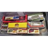 Box containing a collection of various diecast metal bus and car models (boxed)