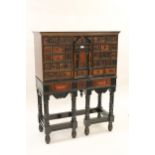 Flemish faux tortoiseshell and ebonised cabinet on stand with Kingwood veneered top and sides, the