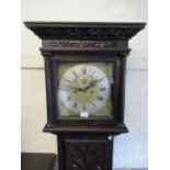 George III oak longcase clock with later carved decoration, the square hood flanked by fluted