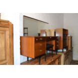 Mid 20th Century Nathan teak dressing table, together with a matching chest of drawers