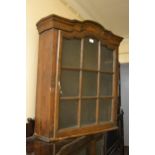 18th / 19th Century Dutch oak wall cabinet, the moulded cornice above a bar glazed door enclosing