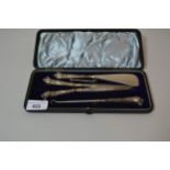 Cased set of silver handled glove stretchers, button hook and shoehorn with leopard's head handles