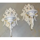 Pair of large white painted cast iron candle wall sconces with pierced armorial style brackets,