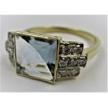 18ct Yellow gold Art Deco style ring set with a central square aquamarine with diamonds each side,