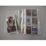 Boxed set of DC Inaugural Edition Cosmic cards in sealed cards, together with an album of various