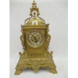 Late 19th / early 20th Century French gilt brass mantel clock, the gilt dial with enamel Roman