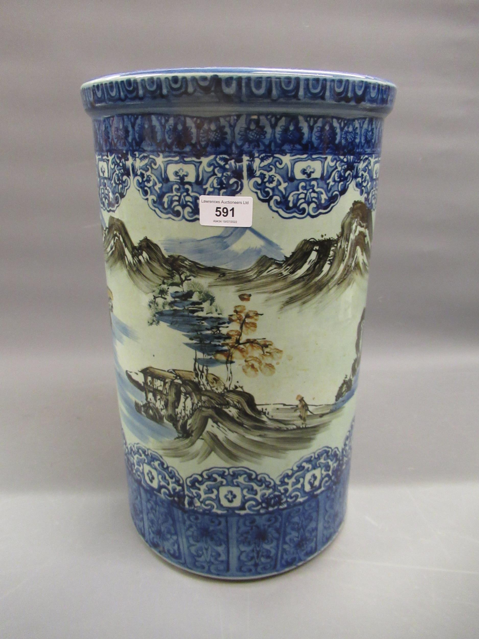 Late 19th Century Japanese porcelain cylindrical stick stand decorated with a continuous landscape