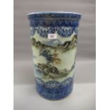 Late 19th Century Japanese porcelain cylindrical stick stand decorated with a continuous landscape