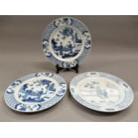 Pair of Chinese blue and white plates decorated with figures on a terrace, six character mark within