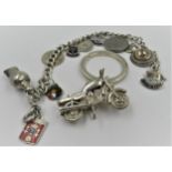 Links of London silver key fob in the form of a motorcycle and a silver charm bracelet with