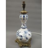 Continental blue and white porcelain and ormolu mounted baluster form lamp base, 14ins high