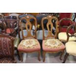 Pair of 20th Century Continental walnut side chairs with splat backs, overstuffed woolwork seats and