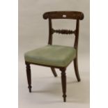 Set of four William IV mahogany dining chairs with carved rail backs, overstuffed seats and turned