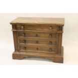 Pair of Venetian walnut dwarf chests, the moulded tops above four drawers raised on bracket feet,