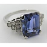 Platinum ring set with a square cut tanzanite with diamond set shoulders, Size O 9mm x 6mm