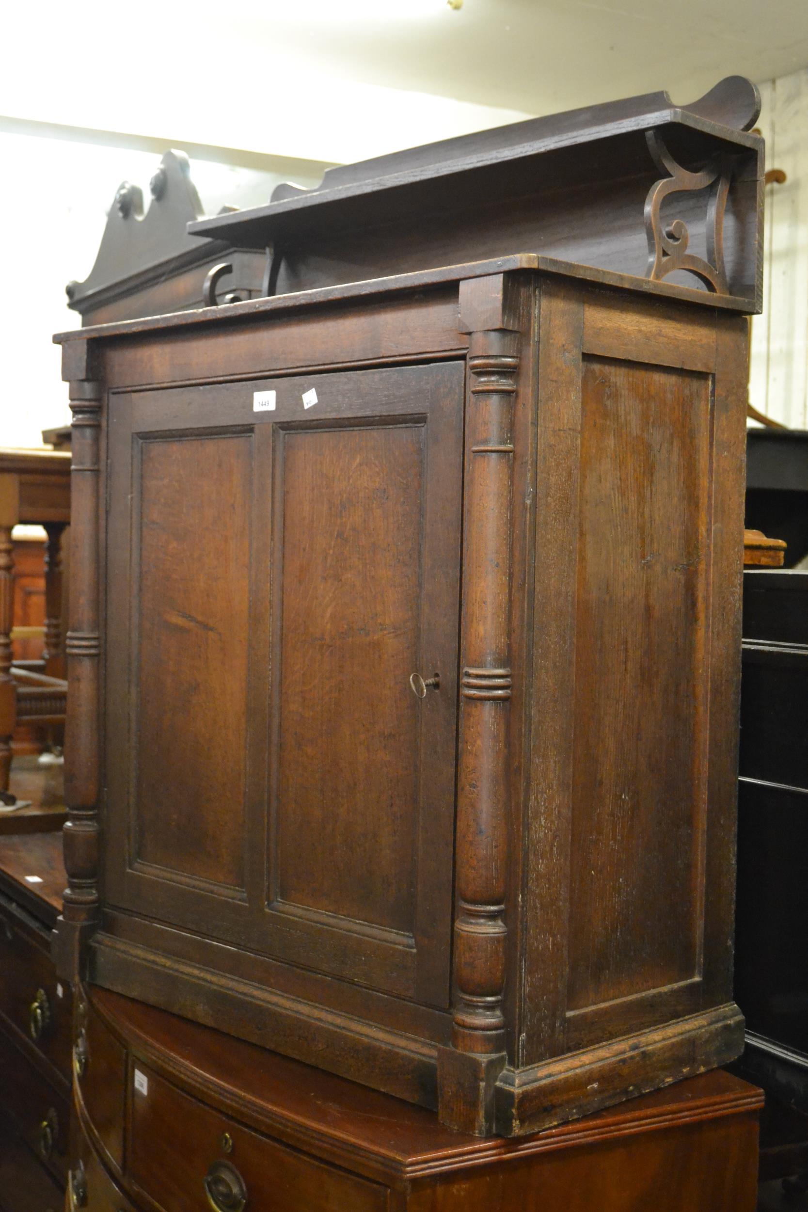 Late 19th Century oak chiffonier, the galleried top above panelled doors on a plinth base, 43ins