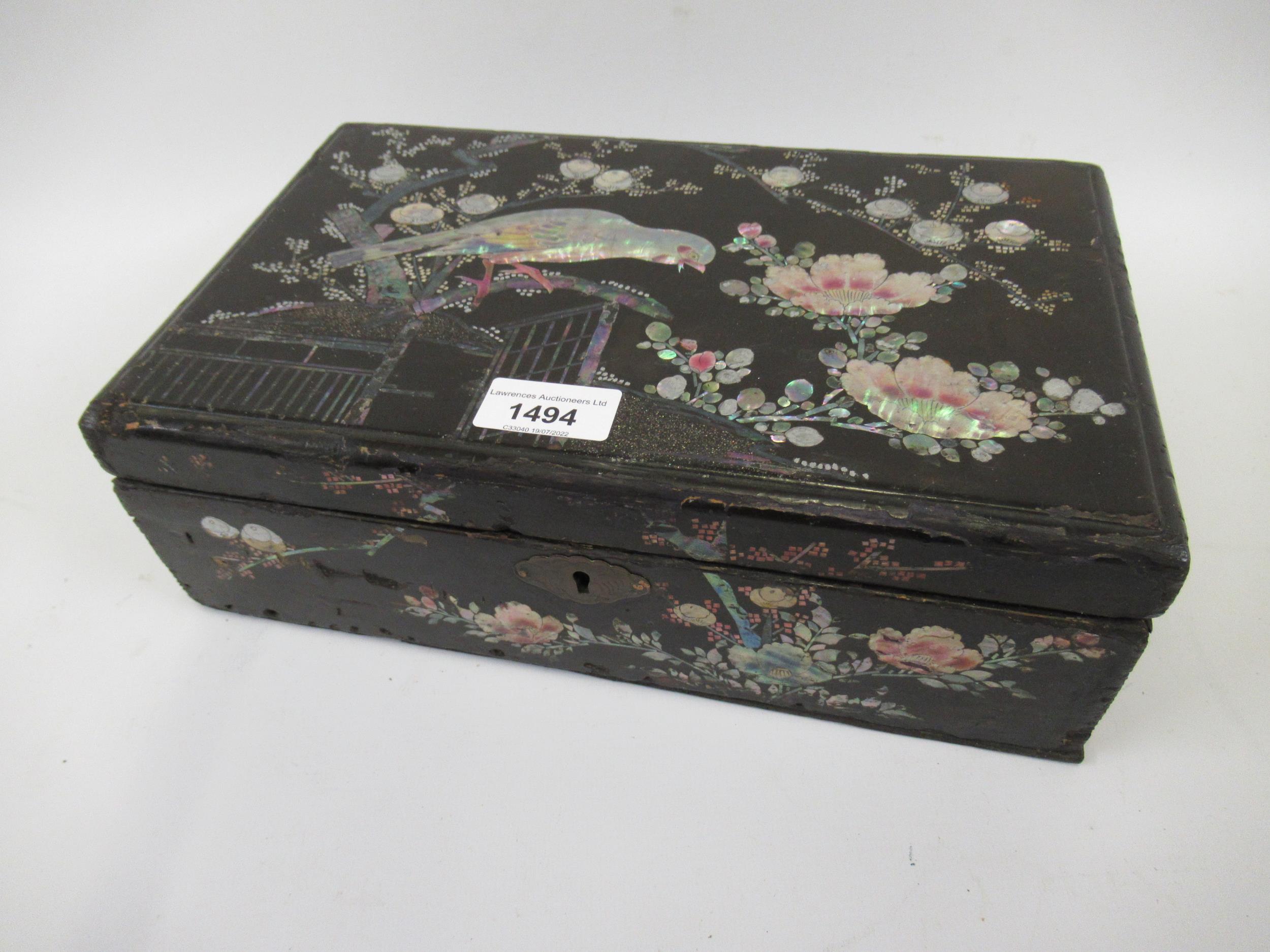 Late 19th Century Japanese lacquer and mother of pearl inlaid box, the hinged lid decorated with