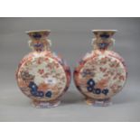 Pair of Chinese moon flasks decorated in iron red and blue (damages), 10.75ins high