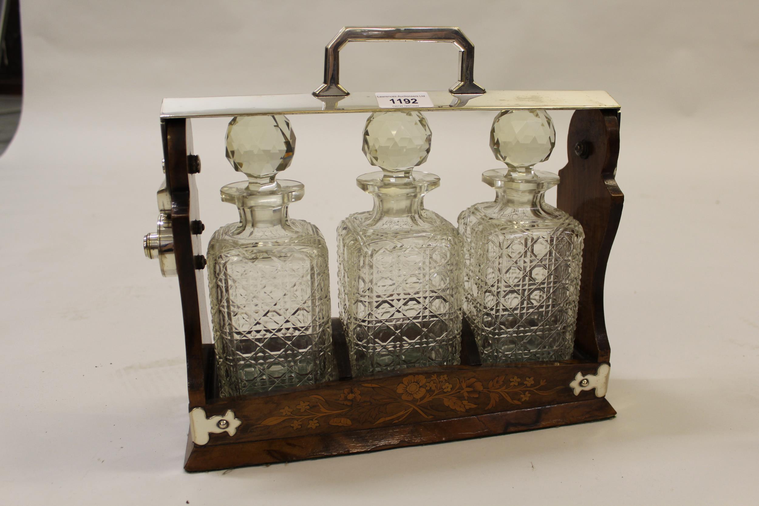 Late 19th / early 20th Century burr walnut floral inlaid and silver plate mounted three bottle