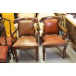 Pair of Anglo Indian style open armchairs with shaped carved cresting rails above leather