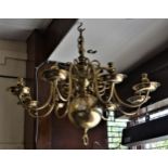 Large 19th Century Dutch eight light chandelier with a knopped baluster centre column and scroll