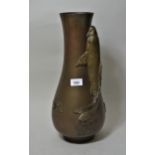 Large Japanese bronze baluster form vase decorated in high relief with a figure of a carp, signed to