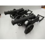Pair of black painted cast metal signal type cannon