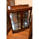 20th Century mahogany bow fronted two door display cabinet on cabriole supports, 34.5ins x 12ins x