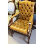 20th Century light tan leather button upholstered open elbow chair on square moulded front supports