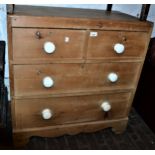 19th Century pine chest of two short above two long drawers with ceramic knob handles, 32ins high