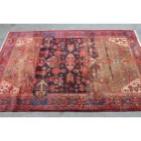 Turkish rug with an all-over stylised floral design on a blue and beige ground with borders, 6ft